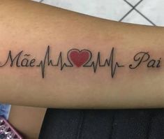 a person with a heartbeat tattoo on their arm