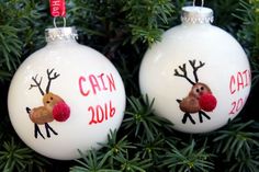 two white christmas ornaments with reindeers on them and the words can't stop