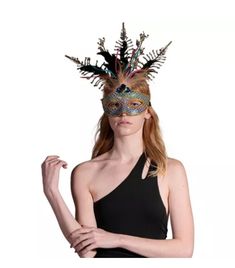 Bring some mystery and elegance to Mardi Gras, Pride and Masquerade with this rainbow sequin, gold trim, real and fabric feathers and gemstones eye mask! This decadent half-mask is covered in a rainbow assortment of sequins and lined in gold around the edges and the eyes! It is held on with an elastic strap. Perfect for Pride, Halloween, Vegas nights, Mardi Gras, cosplay, theatrical productions, parades, festivals and more.Other Mardi Gras and Pride costumes and accessories are sold separately o Multicolor Masquerade Mask For Halloween Party, Feathered Masquerade Mask For Carnival Party, Mardi Gras Feathered Masquerade Mask For Party, Mardi Gras Masquerade Mask With Feathers For Party, Mardi Gras Party Masquerade Mask With Feathers, Fitted Headpieces For Mardi Gras Party, Multicolor Costume Accessories For Party And Carnival, Carnival Party Headpiece With Feathers, Pride Halloween