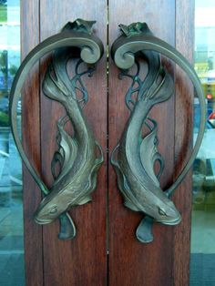 two metal doors with decorative designs on them