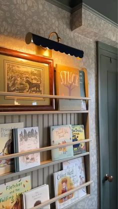 Book Ledges Nursery, Baby Room Bookshelf Ideas, Stuffed Animal Shelf Nursery, Boys Room Book Storage, Corner Book Display, Crib Between Bookshelves, Nursery Book Display, Picture Frame On Bookshelf, Bookshelf With Lighting