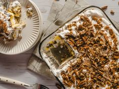 there is a dessert on the table with pecans and other food items around it