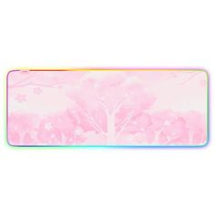 a pink mouse pad with trees and flowers on the front, against a white background