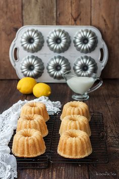 bundt cakes on cooling racks with lemons in the background