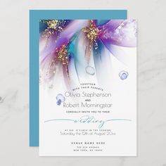 the wedding card is designed to look like an abstract flower with blue, purple and white petals