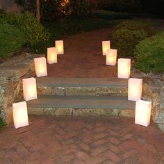 lit candles sitting on steps in the evening