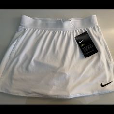 Nike Tennis Skirt Size Xs New Never Worn Nike Sporty Short Skirt, Nike Tennis Skirt For Spring, Sporty Nike Skirt For Spring, Nike Sporty Summer Skirt, Nike Lined Mini Skirt For Spring, Sporty Summer Skirt By Nike, Nike Sports Skirt For Spring, Fitted White Nike Skirt, Nike White Lined Skirt