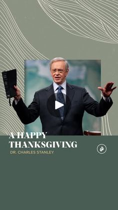 a man in a suit and tie holding his hands up to the side with words that say happy thanksgiving