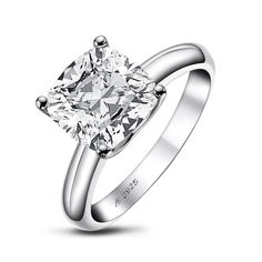 a white gold ring with a princess cut diamond in the center, on a white background