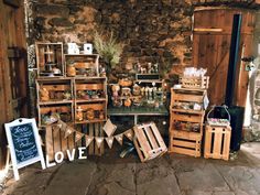 there are many crates on display in this room with the word love spelled below them