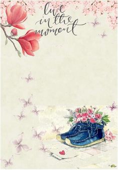 a pair of blue shoes sitting on top of a white floor next to pink flowers