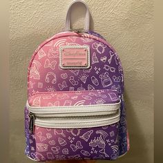 This Gradient Pink To Purple Mini Backpack By Loungefly Features An Allover Print Of Disney Parks Icons In White. From Fantasyland Castles To Ear Hats, From Mickey Waffles To Frozen Treats, This Design Has It! Disney Purple Travel Backpack, Purple Disney Bags For Back To School, Disney Purple Backpack, Disney Purple Bags For Back To School, Purple Disney Backpack, Disney Purple Back To School Bag, Purple Backpack For Disney Trips, Maui Tattoo, Mickey Waffles