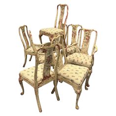 six antique chairs with floral upholstered cushions