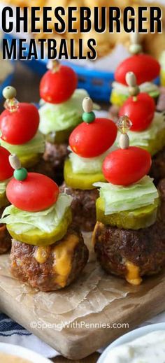 mini cheeseburger meatballs with tomatoes and cucumbers on top are ready to be eaten