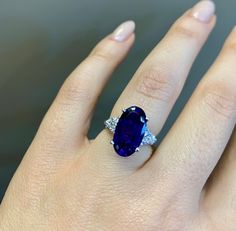 Metal: 14kt White Gold Weight Of Ring Including Stones: 4.30 grams Stone: Diamond And Amethyst Shape: Round and Oval Diamond Total Weight: .20 ctw Amethyst Weight: 5.50 ctw Ring Size: 4 1/2 Sizable: Yes. Please state in size box. Width Of Band: 2.50 mm Customization: This can be custom made with any metals or stones, including stone type, shape, and size. Variations In Stock: Rose Gold Emerald Cut Mystic Topaz- https://www.etsy.com/listing/248521957/rose-gold-427-carat-emerald-cut-mystic?ga_sear Formal White Gold Sapphire Ring With Gemstone Accents, Oval Tanzanite Sapphire Ring, Oval Amethyst Ring In Platinum, Oval Amethyst Ring With Vvs Clarity As Gift, Oval Amethyst Platinum Ring, Oval Sapphire Gemstones With Accents, Oval Sapphire Gemstones, Platinum Amethyst Ring In Fine Jewelry Style, Oval Sapphire Ring With Gemstone Accents In White Gold