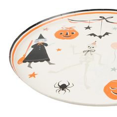 an orange and white tray with halloween decorations on it