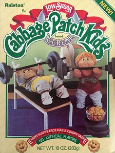 an advertisement for cabbage patch kids with two stuffed animals in front of the advert