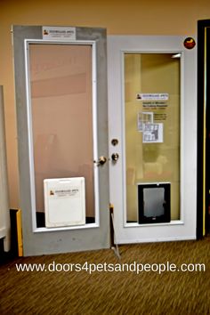 an open door with a screen on the side and a small monitor in the middle