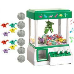 a green and white toy machine with lots of toys in it