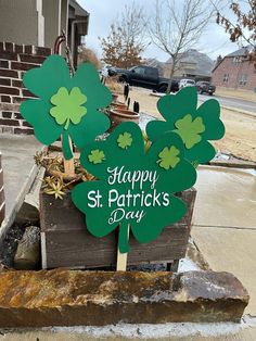 there is a potted plant with four leaf clovers on it that says happy st patrick's day