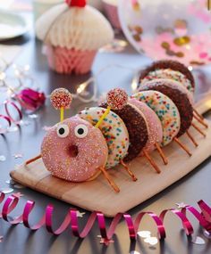 there are donuts with sprinkles in the shape of a caterpillar