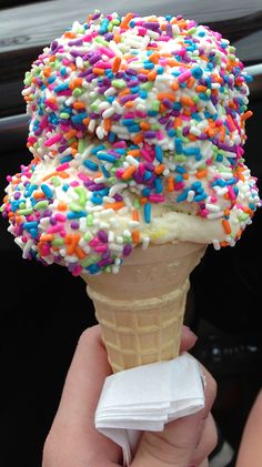 an ice cream cone with sprinkles on top