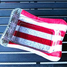 an american flag tray sitting on top of a bench