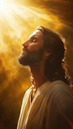 a man with long hair and beard standing in front of the sun shining through clouds