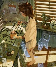 a girl is cooking in the kitchen with cats