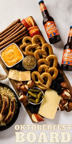 an assortment of beer, pretzels and other snacks