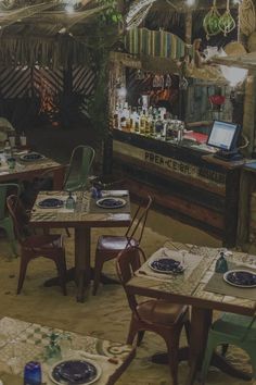 an outdoor restaurant with tables and chairs set up for two people to sit at the table