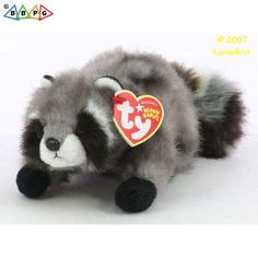 a stuffed animal with a tag on it's ear and nose is laying down