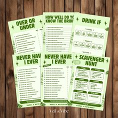 four green drink menus sitting on top of a wooden table