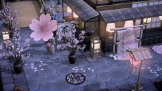 an animated image of a small town with flowers in the foreground and lanterns on the ground