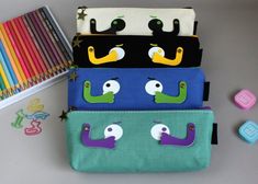 How cute are these pencil pouches for back to school? This would make the perfect back to school or new job gift. Great for both boys and girls. It could also be used as a make up bag or sewing kit.These  pencil cases make the perfect pouch for all ages! Its unique design and style caters to all personalities. Simply fill with pens, pencils, stationery or even travel essentials! This piece will arrive to you in retail packaging! Pencil Pouches, Bridesmaid Diy, Neuer Job, New Job Gift, Job Gifts, Bridesmaid Box, How To Make Ribbon, Unicorn Gifts, Cute Eyes