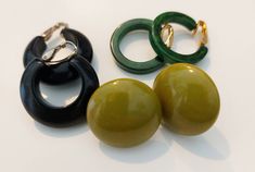 Greens are Simichrome positive. Black, as expected, does not test with Simichrome. All clip on. Green Clip-on Metal Earrings, Cheap Vintage Clip-on Earrings, Green Metal Clip-on Jewelry, Mid-century Clip-on Earrings, Retro Green Clip-on Earrings, Plastic Earrings, Vintage Bakelite, Clip On Earrings, Diy Jewelry