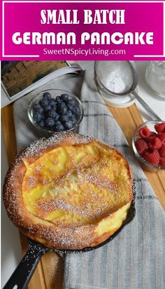 small batch german pancake with powdered sugar and berries