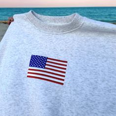 American Flag Embroidered Sweatshirt, 4th of July Sweatshirt, Trendy Crewneck Sweatshirt, Patriotic Sweatshirt, Independence Day Gifts 🎈 Sizing and Coloring - Brand: Gildan. Our top-selling shirt colors consist of Sand, Black, White, Sport Gray, Dark Chocolate, Forest Green, Light Pink, Light Blue, Maroon, Navy, Charcoal, Dark Heather, Royal, Orange, Military Green, and Indigo Blue. - Brand: Comfort Colors®. Our top-selling shirt colors consist of Blue Jean, Blue Spruce, Butter, Chalky Mint, Ch White Long Sleeve T-shirt For 4th Of July, Fourth Of July Embroidery, Patriotic White Cotton Sweatshirt, Casual White Sweatshirt With American Flag Print, Cotton Crew Neck Sweatshirt With Flag Print, Long Sleeve American Style Cotton Sweatshirt, American Style Cotton Long Sleeve Sweatshirt, White Long Sleeve Tops For Independence Day, White Crew Neck Sweatshirt For 4th Of July