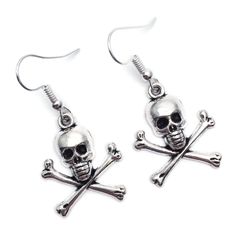 Dangly earrings with silver tone skull and bones charms. The earrings are ca 40mm (1.57 inches) long including hooks. Silver coloured hooks that comply with strict regulations for low nickel and lead content in jewellery. Nickel Free Metal Skull Earrings, Skull-shaped Metal Earrings With Ear Wire, Metal Skull Earrings With Ear Wire, Silver Skull Earrings With Ear Wire, Skull And Crossbones, Dangly Earrings, Skull And Bones, Charm Earrings, Silver Charms