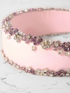 CLIO PEPPIATT Blossom crystal-embellished satin headband | NET-A-PORTER Pink Crown-shaped Headband For Party, Formal Pink Hair Accessories, Elegant Embellished Crown Headpiece, Luxury Formal Headpiece With Structured Crown, Pink Formal Hair Accessories, Glamorous Crystal Embellished Headband, Embellished Headpieces For Evening, Evening Headband With Rhinestones, Elegant Evening Headband With Rhinestones