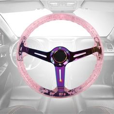 a pink steering wheel cover sitting inside of a car