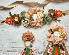 some paper flowers are sitting on top of each other, and one is decorated with an animal