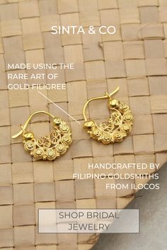 Elevate your wedding look with our Claudia Creolla Earrings, handcrafted by Filipino goldsmiths from Ilocos using the art of gold filigree. Each gold thread is carefully shaped by hand into "kalado" or lace-like patterns inspired by nature. Wear a piece of home on your special day. Click to shop bridal jewelry. Filipiniana weddings | Dream Filipino wedding | FilAm weddings| Filipino American weddings | AAPI weddings | Beach weddings | Wedding fashion inspo | Heirloom jewelry Artisan Gold Hoop Earrings For Festivals, Intricate Design Hoop Earrings For Celebration, Ornate Handmade Hoop Earrings, Handmade Ornate Hoop Earrings, Elegant Ceremonial Hoop Earrings, Elegant Pierced Hoop Earrings For Ceremonial Occasions, Traditional Pierced Hoop Earrings For Celebration, Intricate Hoop Jewelry For Festivals, Traditional Small Hoop Filigree Jewelry