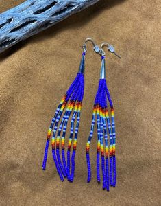 Native American inspired/designed fringe earrings are lovingly handcrafted. They are hand beaded, one bead at a time, with glass seed beads.  They are 4.5" long with a silver plated cone on the top.

I also do custom orders / colors. These will have at least a week added to the shipping time, depending on how many are needed. Native American Beadwork Patterns Loom, Beaded Cone Earrings, Native Beading Patterns Tutorials, Native American Beadwork Earrings, Native Beading, Native Beading Patterns, Native American Beaded Earrings, Native American Crafts, Native Beadwork