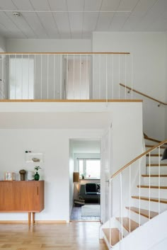 an image of a living room with stairs