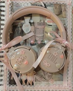 the contents of a personal care kit are arranged in a decorative box with pink ribbon