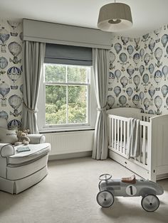 an image of a baby's room with wallpaper and curtains