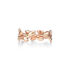 With beautifully sculpted leaves in 18k rose gold, Paloma honors the olive branch, a symbol of peace and abundance. Narrow band ring in 18k rose gold. Original designs copyrighted by Paloma Picasso | Paloma Picasso® Olive Leaf Band Ring in Rose Gold, Narrow, Size: 5 Delicate Rose Gold Open Flower Ring, Paloma Picasso Olive Leaf Ring, Art Nouveau Rose Gold Jewelry Gift, 14k Rose Gold Flower-shaped Jewelry, Twig Rose Gold Ring, Olive Leaf Ring, The Olive Branch, Tiffany Rings, Symbol Of Peace