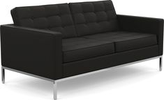 a black leather couch with chrome legs on an isolated white background for use in interior design