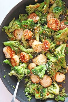 broccoli and scallops with sesame seeds in a skillet